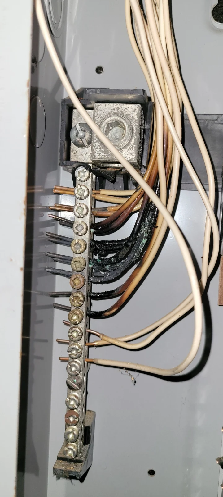 Heat damaged insulation at panel neutral connections